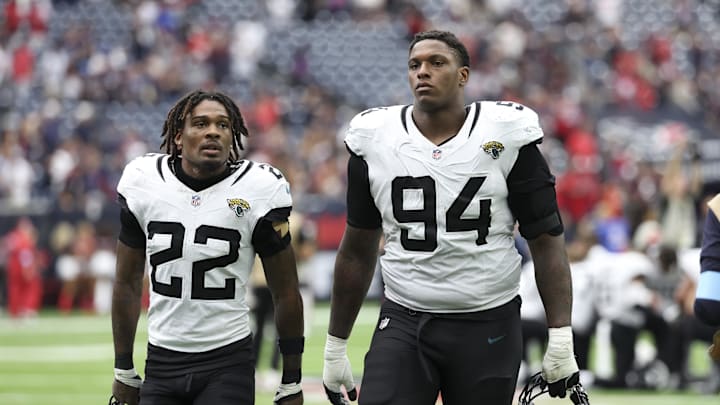 Sep 29, 2024; Houston, Texas, USA; Jacksonville Jaguars cornerback Jarrian Jones (22) and defensive tackle Maason Smith (94) after the game against the Houston Texans at NRG Stadium. Mandatory Credit: Troy Taormina-Imagn Images