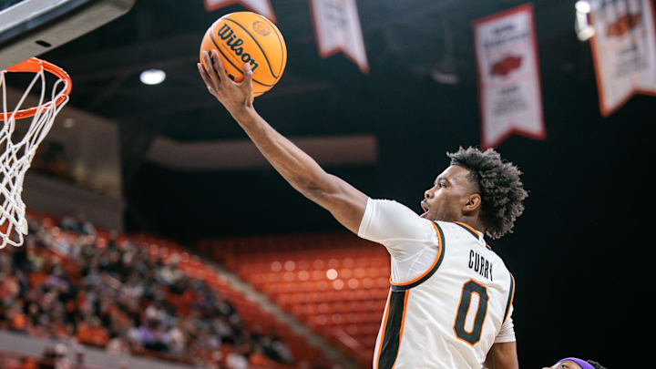 Jan 17, 2026; Stillwater, Oklahoma, USA; Jaylen Curry (0) of the Oklahoma State Cowboys shoots the ball during the first half against the Kansas State Wildcats at Gallagher-Iba Arena. Mandatory Credit: William Purnell-Imagn Images