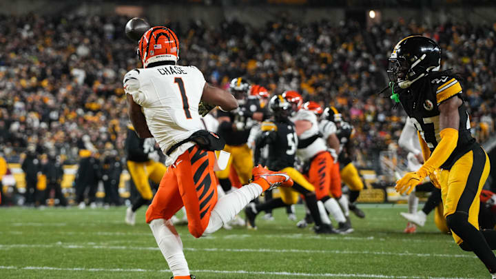Bengals Ja'Marr Chase (1) catches a pass for a touchdown during their game against the Steelers at Acrisure Stadium on Saturday January 4, 2025. The Bengals lead the game at halftime with a score of 13-7.