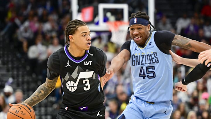 Dec 23, 2025; Salt Lake City, Utah, USA; Utah Jazz guard Keyonte George (3) looks to pass around Memphis Grizzlies forward GG Jackson (45) during the second half at Delta Center. Mandatory Credit: Peter Creveling-Imagn Images