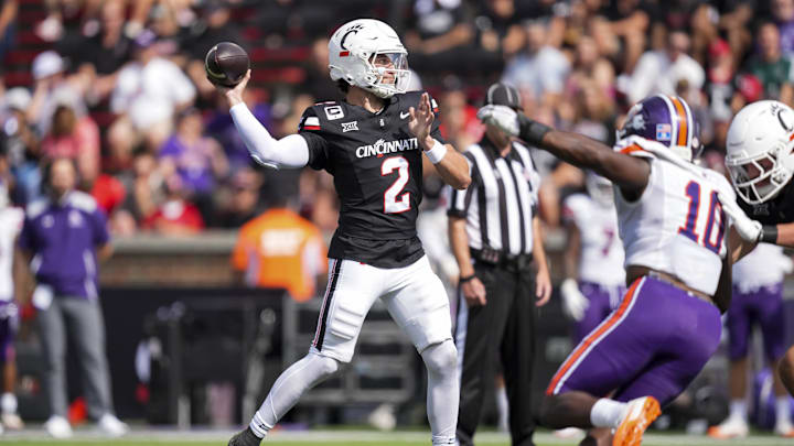Sep 13, 2025; Cincinnati, Ohio, USA;  Cincinnati Bearcats quarterback Brendan Sorsby (2) throws a pass for a touchdown against the Northwestern State Demons in the first half at Nippert Stadium. Mandatory Credit: Aaron Doster-Imagn Images