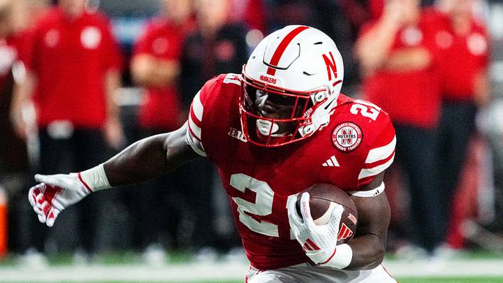 Sep 7, 2024; Lincoln, Nebraska, USA; Nebraska Cornhuskers running back Emmett Johnson (21) runs against the Colorado Buffaloes during the fourth quarter at Memorial Stadium. Mandatory Credit: Dylan Widger-Imagn Images