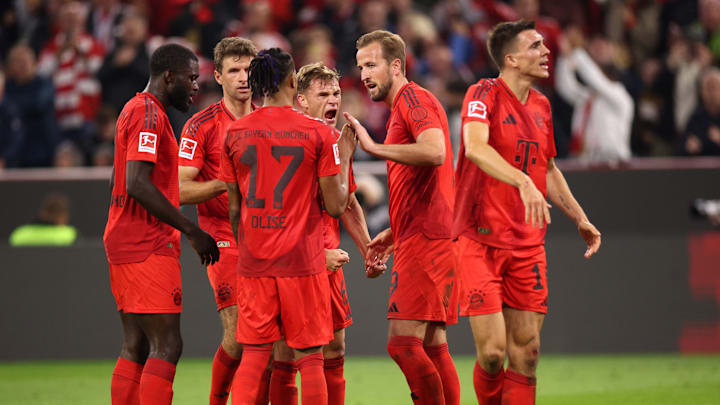 Bayern Munich players celebrating a goal against VfB Stuttgart.