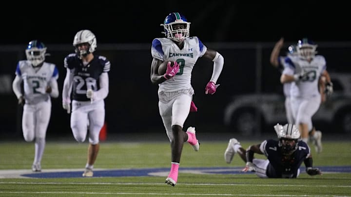 Waden Charles (9) of Somerset Academy-Canyons breaks free for a 79-yard touchdown in the second half