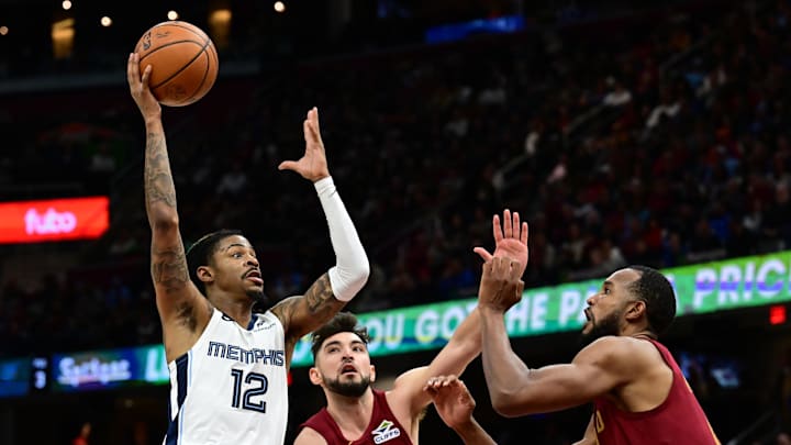 Feb 23, 2025; Cleveland, Ohio, USA; Memphis Grizzlies guard Ja Morant (12) drives to the basket against Cleveland Cavaliers guard Ty Jerome (2) and forward Evan Mobley (4) during the second half at Rocket Arena. Mandatory Credit: Ken Blaze-Imagn Images Feb 23, 2025; Cleveland, Ohio, USA; Memphis Grizzlies guard Ja Morant (12) drives to the basket against Cleveland Cavaliers guard Ty Jerome (2) and forward Evan Mobley (4) during the second half at Rocket Arena. Mandatory Credit: Ken Blaze-Imagn Images
