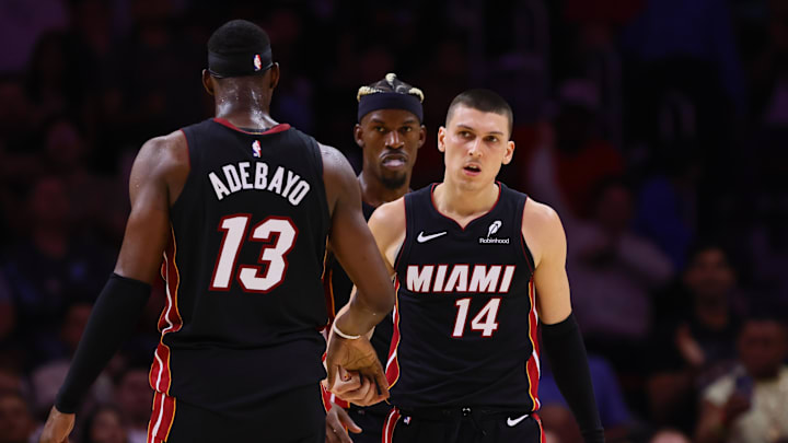 Nov 4, 2024; Miami, Florida, USA; Miami Heat guard Tyler Herro (14) celebrates with Miami Heat center Bam Adebayo (13) after scoring against the Sacramento Kings during the fourth quarter at Kaseya Center. Mandatory Credit: Sam Navarro-Imagn Images