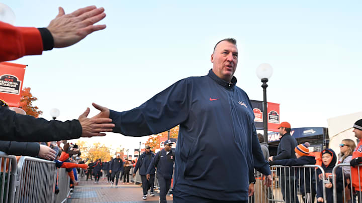 Nov 1, 2025; Champaign, Illinois, USA;  Illinois Fighting Illini head coach Bret Bielema greets fans before an NCAA game against the Rutgers Scarlet Knights at Memorial Stadium. Mandatory Credit: Ron Johnson-Imagn Images