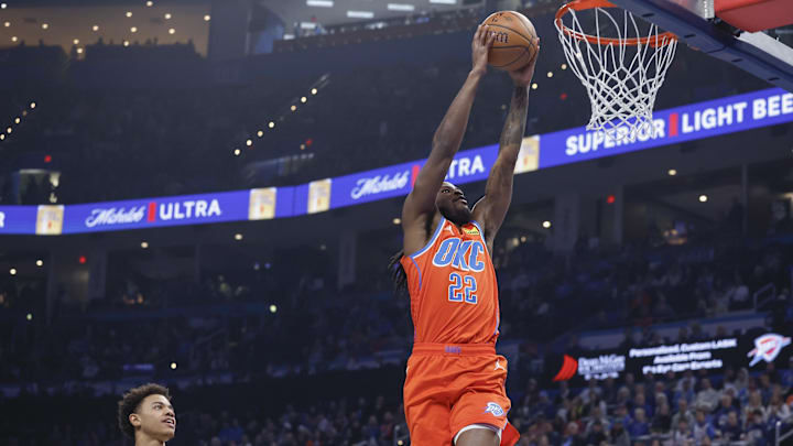 Dec 3, 2024; Oklahoma City, Oklahoma, USA; Oklahoma City Thunder guard Cason Wallace (22) dunks in front of Utah Jazz guard Keyonte George (3) during the first quarter of an NBA Cup game at Paycom Center. Mandatory Credit: Alonzo Adams-Imagn Images Dec 3, 2024; Oklahoma City, Oklahoma, USA; Oklahoma City Thunder guard Cason Wallace (22) dunks in front of Utah Jazz guard Keyonte George (3) during the first quarter of an NBA Cup game at Paycom Center. Mandatory Credit: Alonzo Adams-Imagn Images