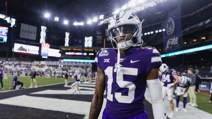 Dec. 26, 2024: Trae Davis (15) warms up for the Rate Bowl in Phoenix, Arizona.