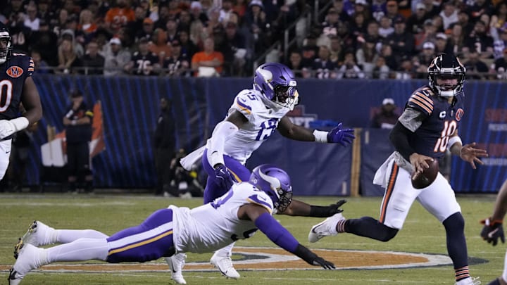 Chicago Bears quarterback Caleb Williams (18) rushes the ball against the Minnesota Vikings