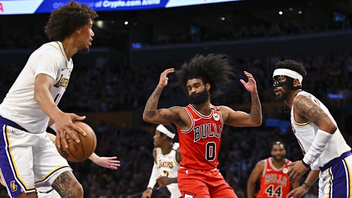 Mar 22, 2025; Los Angeles, California, USA; Chicago Bulls guard Coby White (0) reacts after losing possession against Los Angeles Lakers center Jaxson Hayes (11) and guard Jordan Goodwin (30) during the second half at Crypto.com Arena. Mandatory Credit: Jonathan Hui-Imagn Images Mar 22, 2025; Los Angeles, California, USA; Chicago Bulls guard Coby White (0) reacts after losing possession against Los Angeles Lakers center Jaxson Hayes (11) and guard Jordan Goodwin (30) during the second half at Crypto.com Arena. Mandatory Credit: Jonathan Hui-Imagn Images