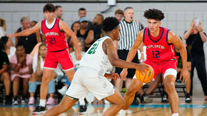 Columbus Explorers forward Cameron Boozer (12) defends De La Salle forward AJ Morgan during the Section 7 Basketball Tournament at State Farm Stadium in Glendale on June 23, 2023. Columbus Explorers forward Cameron Boozer (12) defends De La Salle forward AJ Morgan during the Section 7 Basketball Tournament at State Farm Stadium in Glendale on June 23, 2023.