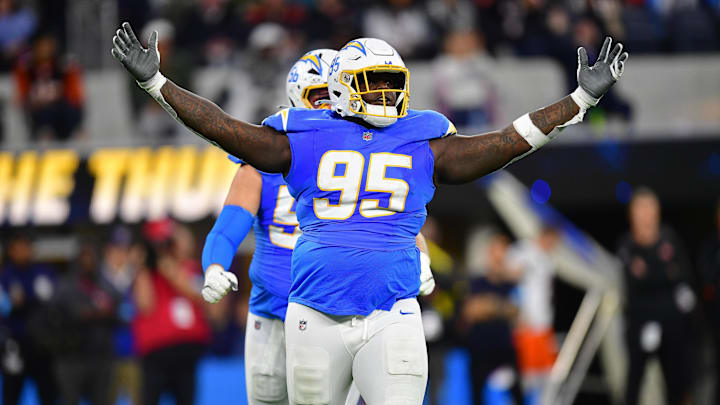 Nov 17, 2024; Inglewood, California, USA; Los Angeles Chargers defensive tackle Poona Ford (95) reacts after sacking Cincinnati Bengals quarterback Joe Burrow (9) during the first half at SoFi Stadium. Nov 17, 2024; Inglewood, California, USA; Los Angeles Chargers defensive tackle Poona Ford (95) reacts after sacking Cincinnati Bengals quarterback Joe Burrow (9) during the first half at SoFi Stadium.