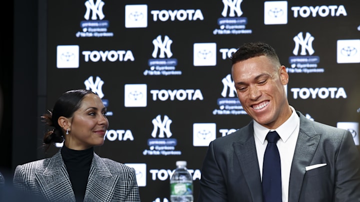 Aaron Judge and Samantha Judge react during a press conference at Yankee Stadium. 