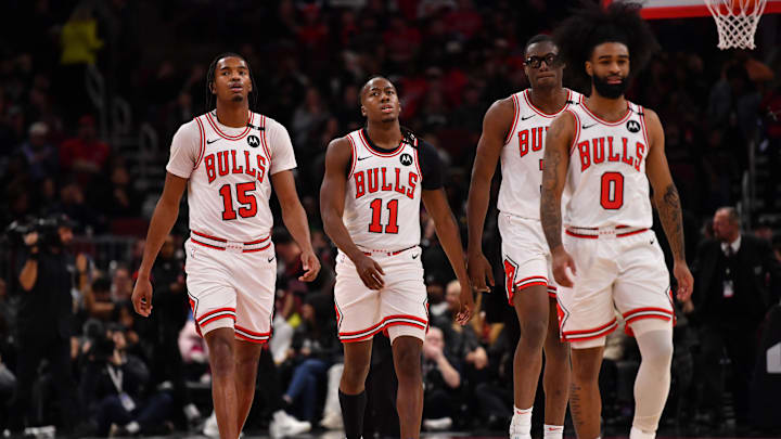 Feb 28, 2025; Chicago, Illinois, USA; (from left to right) Chicago Bulls forward Julian Phillips, guard Ayo Dosunmu, forward Jalen Smith, and guard Coby White are seen during a game against the Toronto Raptors at the United Center. Mandatory Credit: Patrick Gorski-Imagn Images