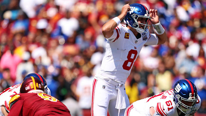 Sep 15, 2024; Landover, Maryland, USA; New York Giants quarterback Daniel Jones (8) signals at the line of scrimmage against the Washington Commanders at Commanders Field. Mandatory Credit: Peter Casey-Imagn Images Sep 15, 2024; Landover, Maryland, USA; New York Giants quarterback Daniel Jones (8) signals at the line of scrimmage against the Washington Commanders at Commanders Field. Mandatory Credit: Peter Casey-Imagn Images