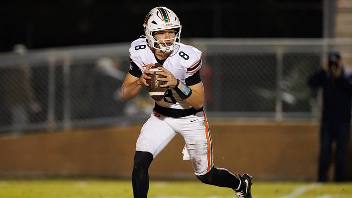 Mandarin Mustangs quarterback Knox Annis (8) runs with the ball against the Buchholz Bobcats during the first half at the 2025 FHSAA Football State Championships 6A Regional Finals at Citizens Field in Gainesville, FL on Friday, November 28, 2025. [Matt Pendleton/Gainesville Sun]