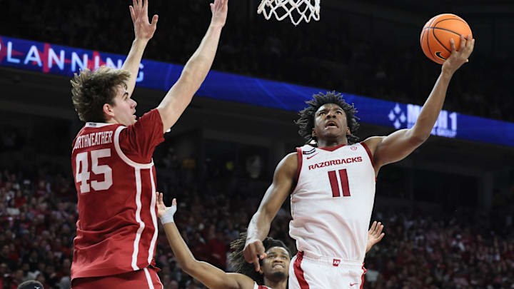 Jan 25, 2025; Fayetteville, Arkansas, USA; Arkansas Razorbacks forward Karter Knox (11) shoots in the second half as Oklahoma Sooners forward Luke Northweather (45) defends at Bud Walton Arena. Oklahoma won 65-62. Mandatory Credit: Nelson Chenault-Imagn Images