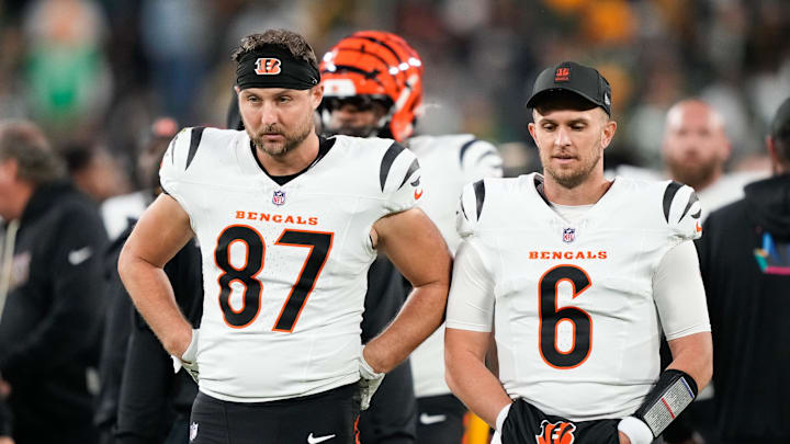 Oct 12, 2025; Green Bay, Wisconsin, USA; Cincinnati Bengals tight end Tanner Hudson (87) and quarterback Jake Browning (6) walk off the field after the game against the Green Bay Packers at Lambeau Field. Mandatory Credit: Kayla Wolf-Imagn Images
