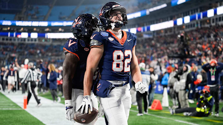 Dec 6, 2025; Charlotte, NC, USA; Virginia Cavaliers wide receiver Eli Wood (82) celebrates a touchdown in the second half against the Duke Blue Devils during the 2025 ACC Championship game at Bank of America Stadium. Mandatory Credit: Jim Dedmon-Imagn Images Dec 6, 2025; Charlotte, NC, USA; Virginia Cavaliers wide receiver Eli Wood (82) celebrates a touchdown in the second half against the Duke Blue Devils during the 2025 ACC Championship game at Bank of America Stadium. Mandatory Credit: Jim Dedmon-Imagn Images