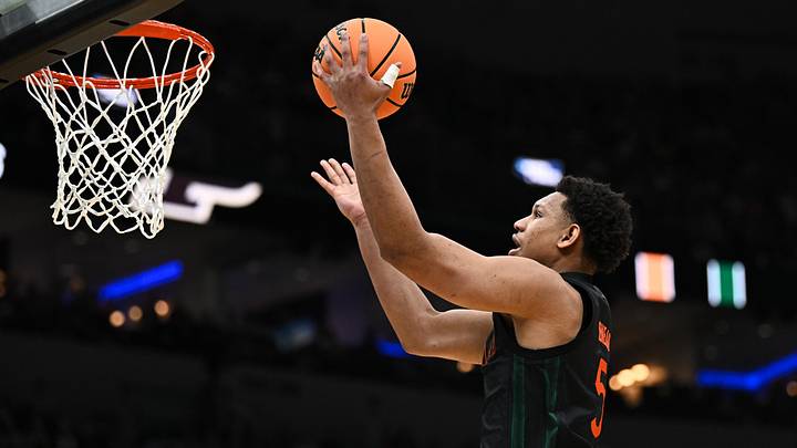 Mar 22, 2026; St. Louis, MO, USA; Miami Hurricanes forward Malik Reneau (5) shoots a lay up during the second half against the Purdue Boilermakers during a second round game of the men's 2026 NCAA Tournament at Enterprise Center.