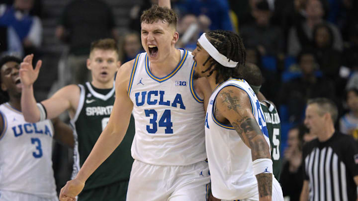 Feb 4, 2025; Los Angeles, California, USA; UCLA Bruins guard Skyy Clark (55) and forward Tyler Bilodeau (34) celebrate after a basket during the second half against the Michigan State Spartans at Pauley Pavilion presented by Wescom. Mandatory Credit: Jayne Kamin-Oncea-Imagn Images
