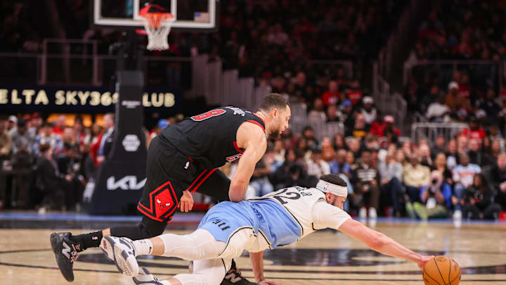 Dec 26, 2024; Atlanta, Georgia, USA; Atlanta Hawks forward Larry Nance Jr. (22) steals the ball from Chicago Bulls guard Zach LaVine (8) in the third quarter at State Farm Arena. Mandatory Credit: Brett Davis-Imagn Images
