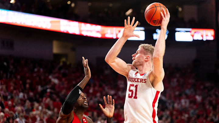 Nebraska Cornhuskers forward Rienk Mast shoots the ball against Rutgers Scarlet Knights center Clifford Omoruyi. Nebraska Cornhuskers forward Rienk Mast shoots the ball against Rutgers Scarlet Knights center Clifford Omoruyi.