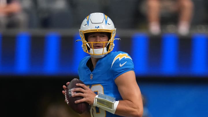Aug 16, 2025; Inglewood, California, USA; Los Angeles Chargers quarterback Justin Herbert (10) throws the ball against the Los Angeles Rams in the first half at SoFi Stadium.