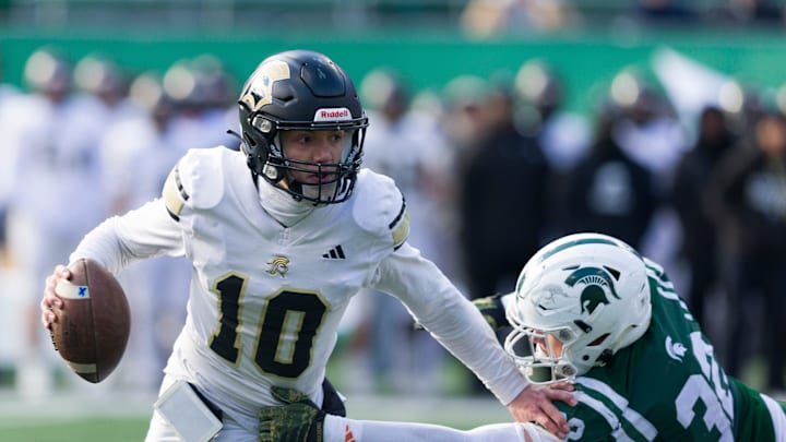 East Rutherford, NJ -- November 28, 2025 -- Paramus Catholic quarterback Marco Green (10) gets nabbed by DePaul tackler Logan Nagle (32) in the Non-Public B high school football championship on Friday at MetLife Stadium. Steve Hockstein/Special to NorthJersey.com