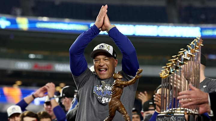 Oct 30, 2024; New York, New York, USA; Los Angeles Dodgers manager Dave Roberts (30) celebrates after winning the 2024 MLB World Series against the New York Yankees at Yankee Stadium. Mandatory Credit: Vincent Carchietta-Imagn Images