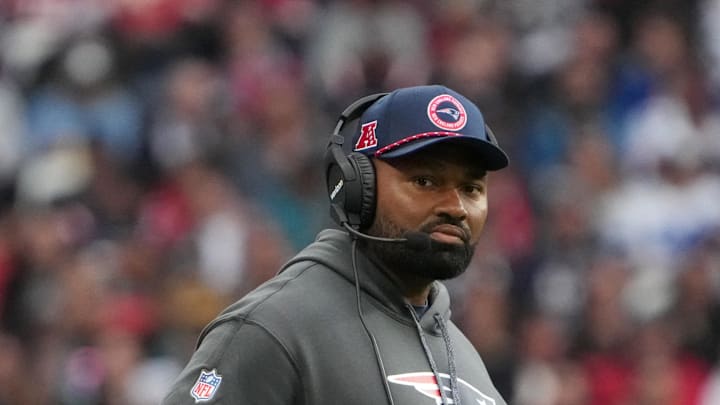 Oct 20, 2024; London, United Kingdom; New England Patriots coach Jerod Mayo watches from the sidelines against the New England Patriots in the second half of an NFL International Series game at Wembley Stadium. Mandatory Credit: Kirby Lee-Imagn Images