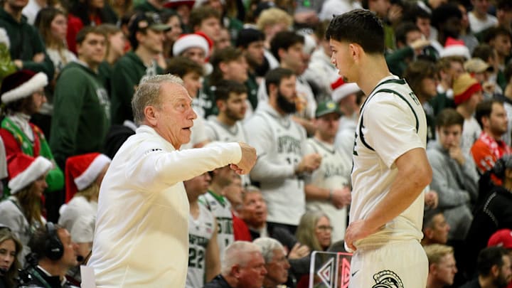 Dec 7, 2024; East Lansing, Michigan, USA;  Michigan State Spartans head coach Tom Izzo teaches Michigan State Spartans forward Frankie Fidler (8) on the sideline during the first half at Jack Breslin Student Events Center. Mandatory Credit: Dale Young-Imagn Images