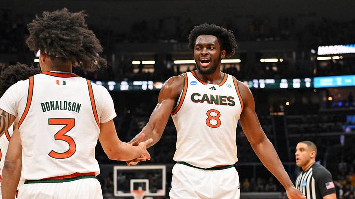 Mar 20, 2026; St. Louis, MO, USA; Miami (FL) Hurricanes center Ernest Udeh Jr. (8) and Miami (FL) Hurricanes guard Tre Donaldson (3) react after a play during the first half against the Missouri Tigers during a first round game of the men's 2026 NCAA Tournament at Enterprise Center. Mandatory Credit: Jeff Curry-Imagn Images Mar 20, 2026; St. Louis, MO, USA; Miami (FL) Hurricanes center Ernest Udeh Jr. (8) and Miami (FL) Hurricanes guard Tre Donaldson (3) react after a play during the first half against the Missouri Tigers during a first round game of the men's 2026 NCAA Tournament at Enterprise Center. Mandatory Credit: Jeff Curry-Imagn Images