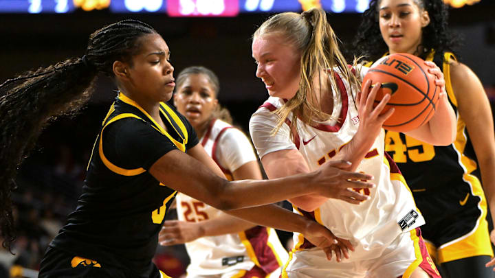 Jan 29, 2026; Los Angeles, California, USA; USC Trojans forward Gerda Raulusaityte (8) rebounds away from Iowa Hawkeyes guard Journey Houston (8) in the second half at Galen Center. Mandatory Credit: Jayne Kamin-Oncea-Imagn Images