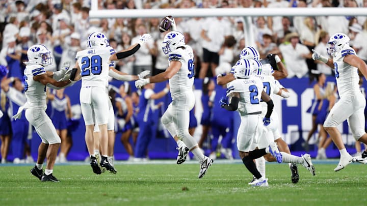 The BYU defense celebrates as Tyler Batty snags an interception against Kansas State.