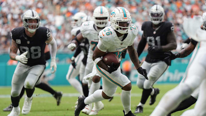 Miami Dolphins running back Salvon Ahmed (26) breaks free for a touchdown during the first half of an NFL game against the Las Vegas Raiders at Hard Rock Stadium in Miami Gardens, Nov. 19, 2023.