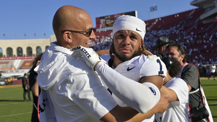 Penn State safety Jaylen Reed is congratulated by head coach James Franklin after defeating the USC Trojans in overtime at Los Angeles Memorial Coliseum.