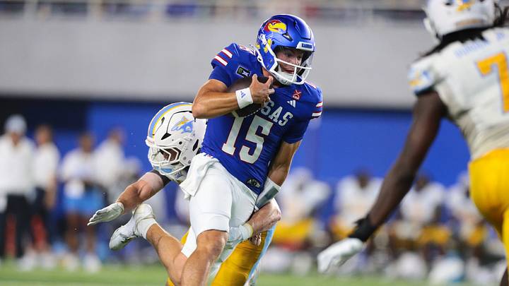 Kansas Jayhawks quarterback Cole Ballard (15) Kansas Jayhawks quarterback Cole Ballard (15)