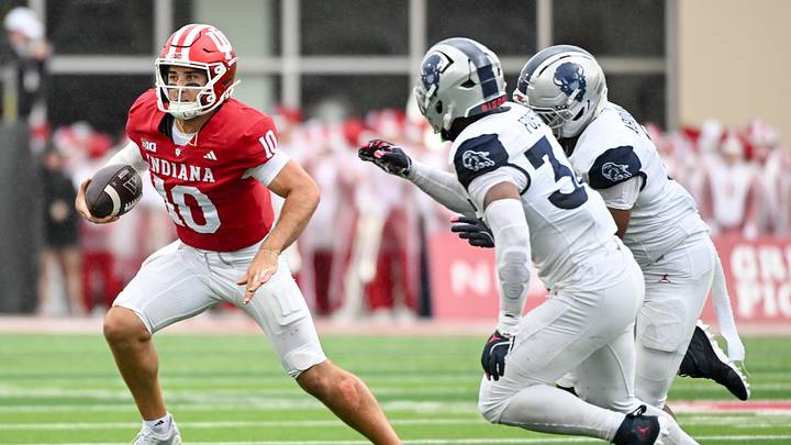 Sep 12, 2026; Bloomington, Indiana, USA; Indiana Hoosiers quarterback Josh Hoover (10) runs the ball against the Howard Bison during the first half at Merchants Bank Field at Memorial Stadium. Mandatory Credit: Robert Goddin-Imagn Images Sep 12, 2026; Bloomington, Indiana, USA; Indiana Hoosiers quarterback Josh Hoover (10) runs the ball against the Howard Bison during the first half at Merchants Bank Field at Memorial Stadium. Mandatory Credit: Robert Goddin-Imagn Images