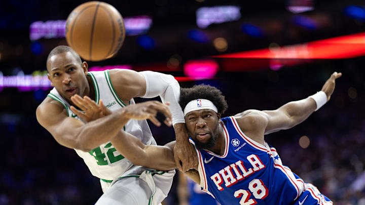 Feb 20, 2025; Philadelphia, Pennsylvania, USA; Philadelphia 76ers forward Guerschon Yabusele (28) and Boston Celtics center Al Horford (42) battle for a loose ball during the third quarter at Wells Fargo Center. Mandatory Credit: Bill Streicher-Imagn Images