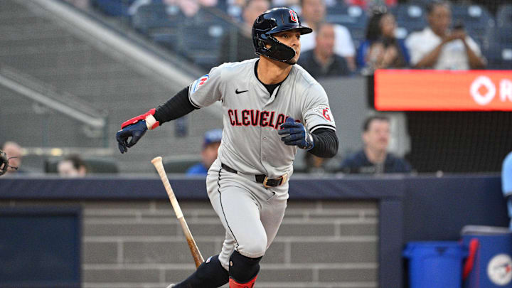 Jun 14, 2024; Toronto, Ontario, CAN;  Cleveland Guardians second baseman Andres Gimenez (0) hits an RBI single against the Toronto Blue Jays in the fifth inning at Rogers Centre. Mandatory Credit: Dan Hamilton-Imagn Images
