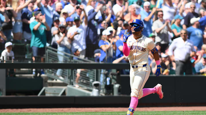 Seattle Mariners center fielder Julio Rodriguez (44) runs towards home plate after hitting a 2-run home run against the Oakland Athletics during the second inning at T-Mobile Park in 2024.
