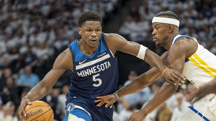May 8, 2025; Minneapolis, Minnesota, USA; Minnesota Timberwolves guard Anthony Edwards (5) dribbles the ball past Golden State Warriors forward Jimmy Butler III (10) in the first half during game two of the second round for the 2025 NBA Playoffs at Target Center. Mandatory Credit: Jesse Johnson-Imagn Images May 8, 2025; Minneapolis, Minnesota, USA; Minnesota Timberwolves guard Anthony Edwards (5) dribbles the ball past Golden State Warriors forward Jimmy Butler III (10) in the first half during game two of the second round for the 2025 NBA Playoffs at Target Center. Mandatory Credit: Jesse Johnson-Imagn Images
