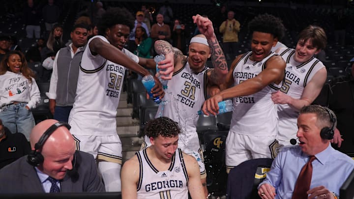 Mar 4, 2025; Atlanta, Georgia, USA; Georgia Tech Yellow Jackets guard Lance Terry (0) is doused with water by forward Ibrahim Souare (30) and forward Duncan Powell (31) and guard Jaeden Mustaf (3) and forward Emmer Nichols (35) after a victory over the Miami Hurricanes at McCamish Pavilion. Mandatory Credit: Brett Davis-Imagn Images