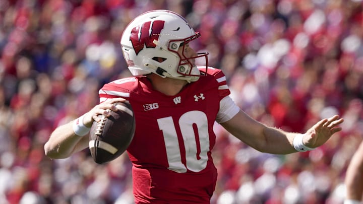 Sep 7, 2024; Madison, Wisconsin, USA;  Wisconsin Badgers quarterback Tyler Van Dyke (10) throws a pass during the first quarter against the South Dakota Coyotes at Camp Randall Stadium. Mandatory Credit: Jeff Hanisch-Imagn Images