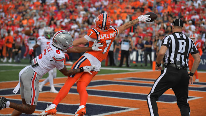 Oct 11, 2025; Champaign, Illinois, USA; Illinois Fighting Illini wide receiver Alexander Capka-Jones (7) misses a pass under pressure from Ohio State Buckeyes cornerback Devin Sanchez (6) during the second half at Memorial Stadium. Mandatory Credit: Ron Johnson-Imagn Images Oct 11, 2025; Champaign, Illinois, USA; Illinois Fighting Illini wide receiver Alexander Capka-Jones (7) misses a pass under pressure from Ohio State Buckeyes cornerback Devin Sanchez (6) during the second half at Memorial Stadium. Mandatory Credit: Ron Johnson-Imagn Images