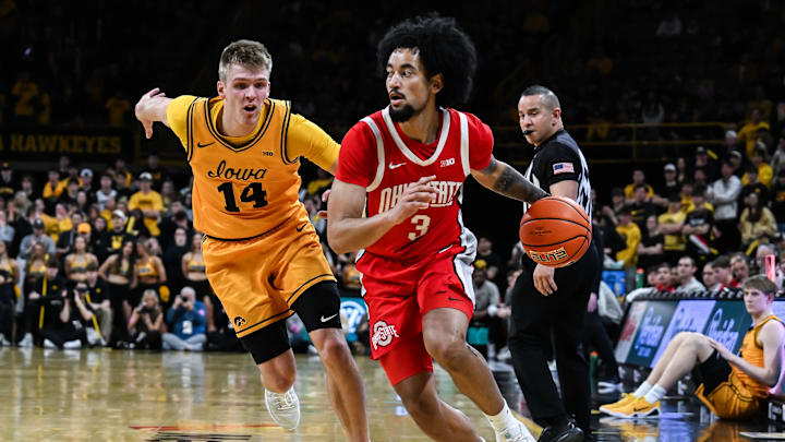 Feb 25, 2026; Iowa City, Iowa, USA; Ohio State Buckeyes guard Taison Chatman (3) controls the ball as Iowa Hawkeyes guard Bennett Stirtz (14) defends during the first half at Carver-Hawkeye Arena. Mandatory Credit: Jeffrey Becker-Imagn Images