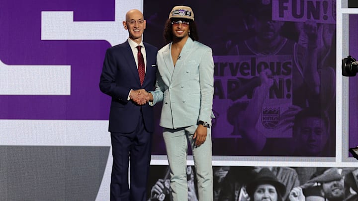 Jun 26, 2024; Brooklyn, NY, USA; Devin Carter poses for photos with NBA commissioner Adam Silver after being selected in the first round by the Sacramento Kings in the 2024 NBA Draft at Barclays Center. Mandatory Credit: Brad Penner-USA TODAY Sports