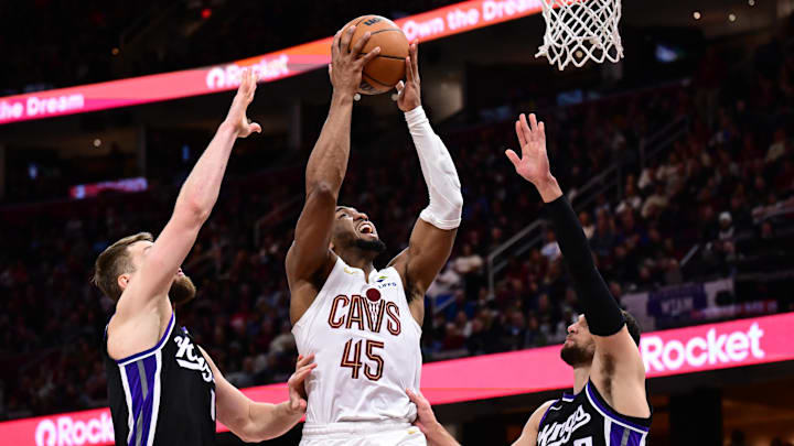 Apr 6, 2025; Cleveland, Ohio, USA; Cleveland Cavaliers guard Donovan Mitchell (45) drives to the basket between Sacramento Kings forward Domantas Sabonis (11) guard Zach LaVine (8) during the second half at Rocket Arena. Mandatory Credit: Ken Blaze-Imagn Images Apr 6, 2025; Cleveland, Ohio, USA; Cleveland Cavaliers guard Donovan Mitchell (45) drives to the basket between Sacramento Kings forward Domantas Sabonis (11) guard Zach LaVine (8) during the second half at Rocket Arena. Mandatory Credit: Ken Blaze-Imagn Images